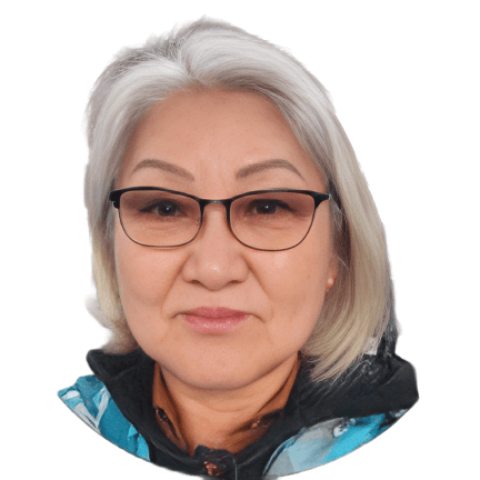 A woman with short gray hair, wearing glasses and a blue patterned scarf, smiles softly in a portrait—perfect for sharing her positive Citrus Heights dental reviews against a plain white background.
